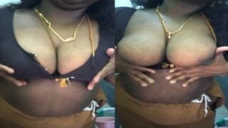 Sri Lankan Aunty strips jacket and squeezing big boobs